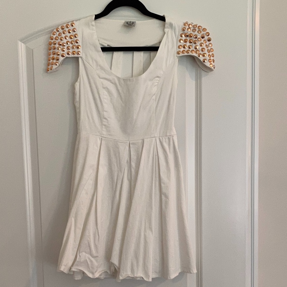 White dress with gold studded shoulders